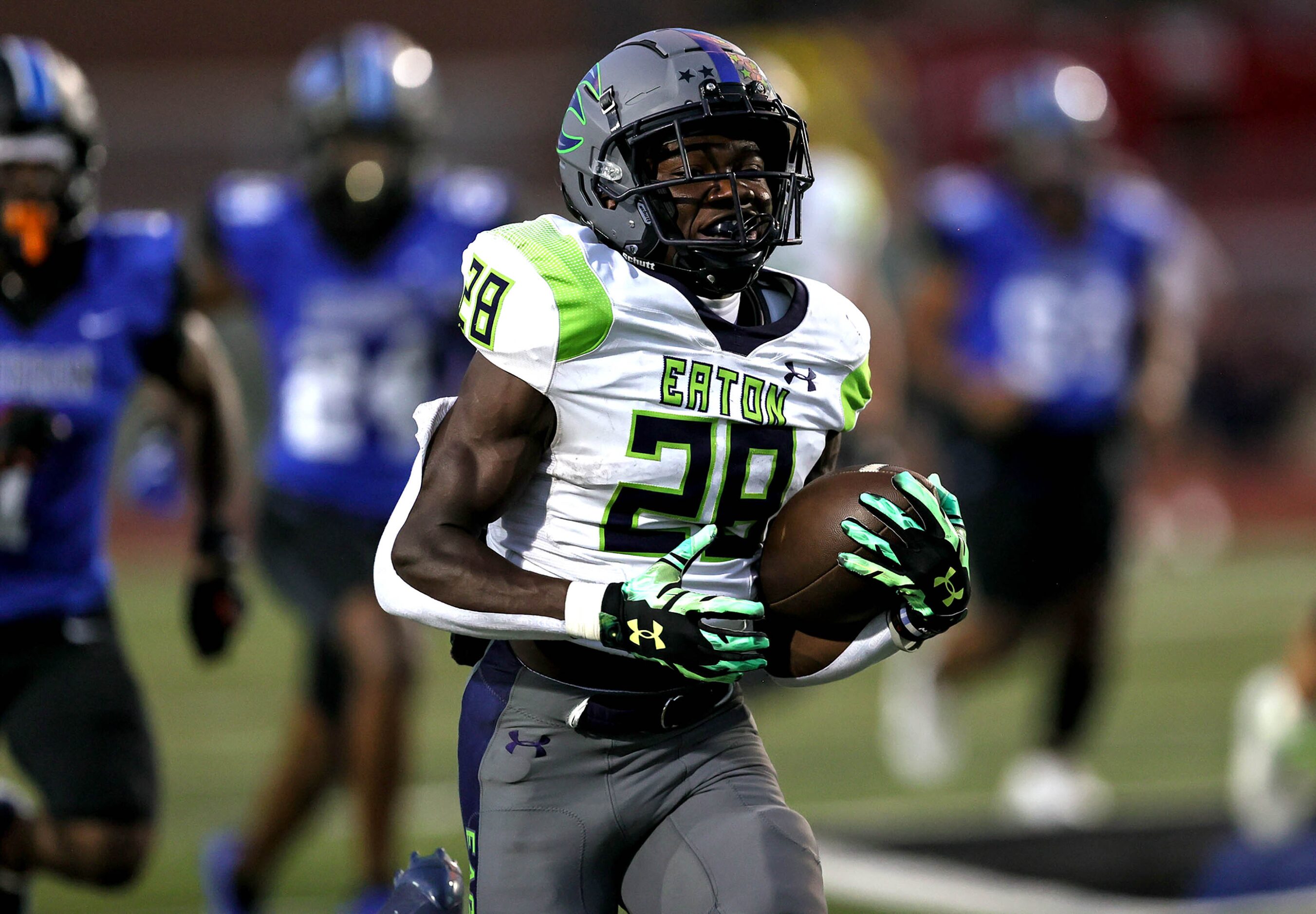 Eaton running back Demarion Williams (28) goes 68 yards for a touchdown against Hebron...