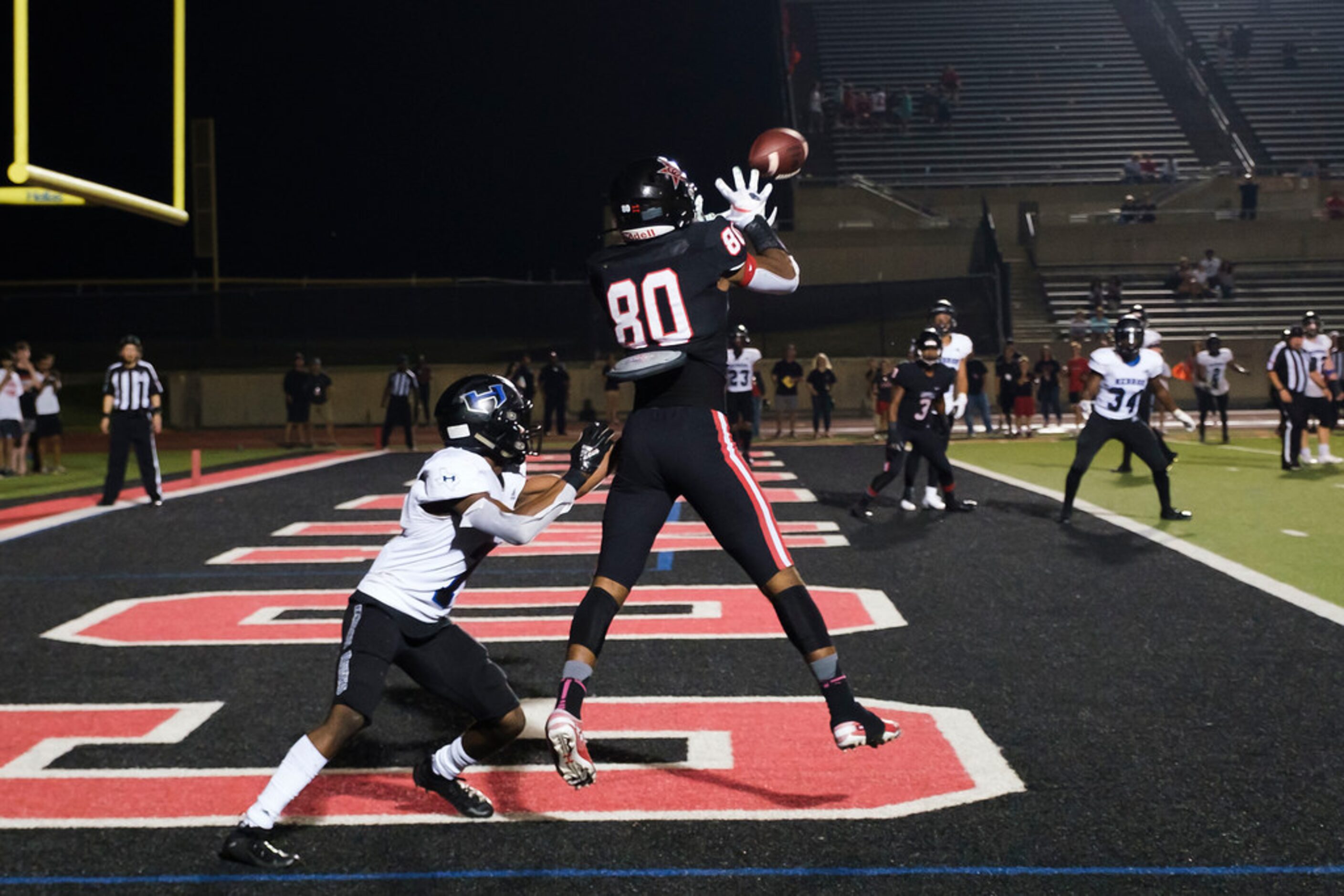 Coppell wide receiver Bishop Bell (80) catches a touchdown pass as Hebron defensive back...