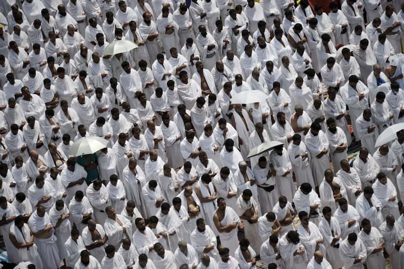 Muslim pilgrims gather to perform noon and afternoon prayers at Namira Mosque in Mount...