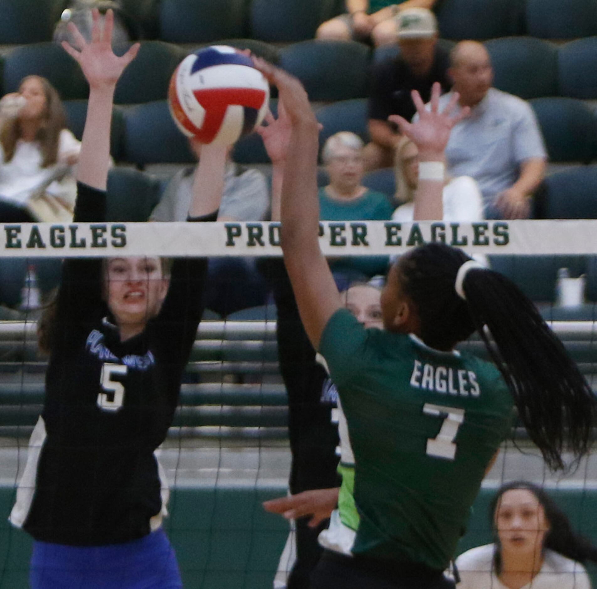 Prosper's Bailey Birmingham (7) fires a shot into the defense of Plano West defenders Hunter...