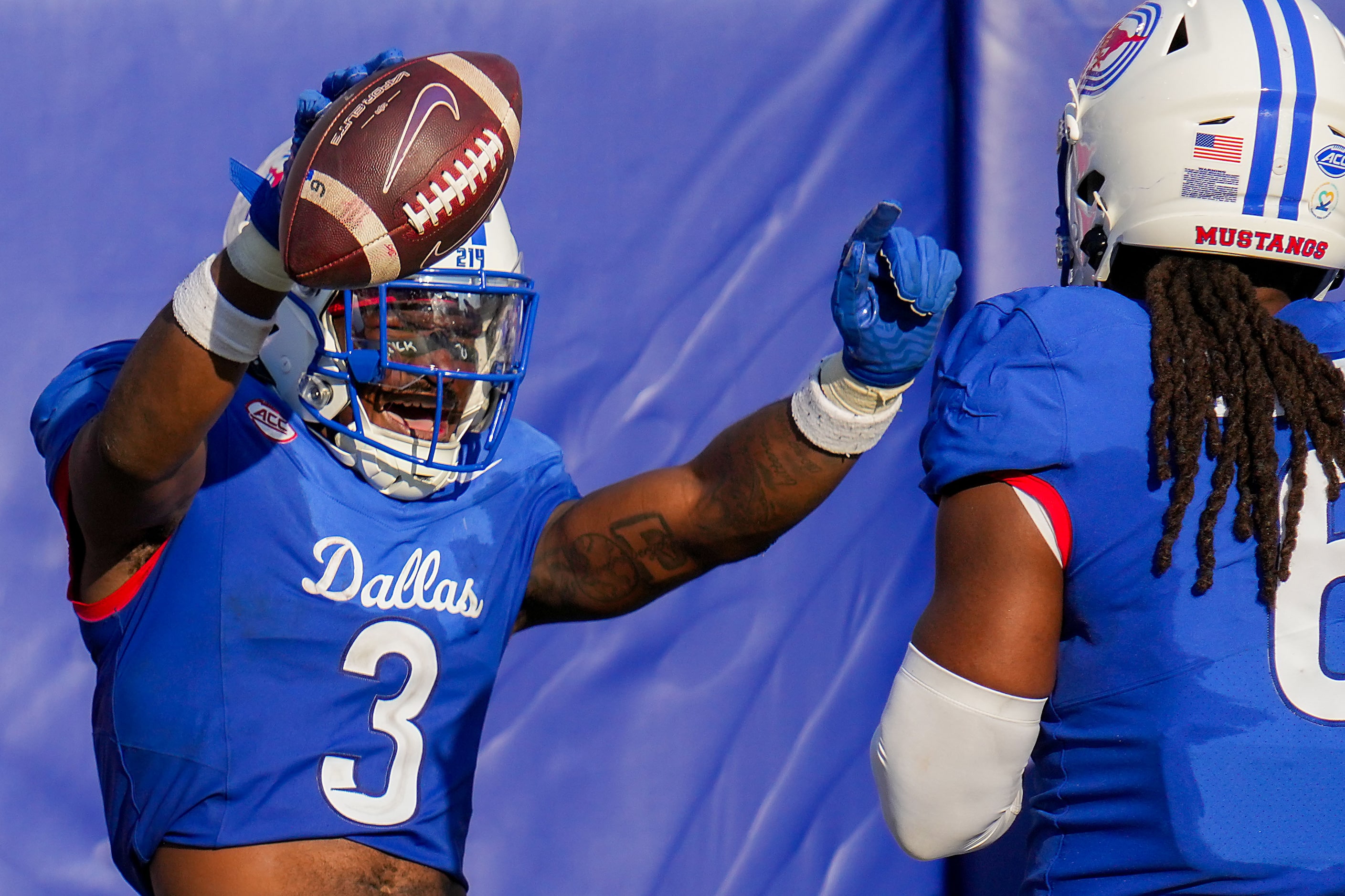 SMU safety Ahmaad Moses (3) celebrates after returning an interception 34 yards for a...