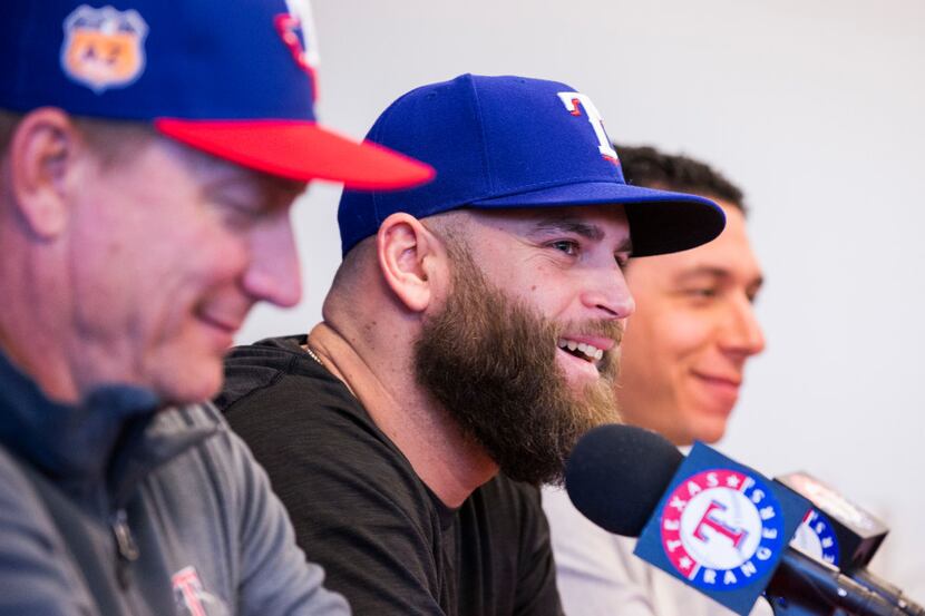 First baseman Mike Napoli, center, speaks during a press conference announcing that he has...