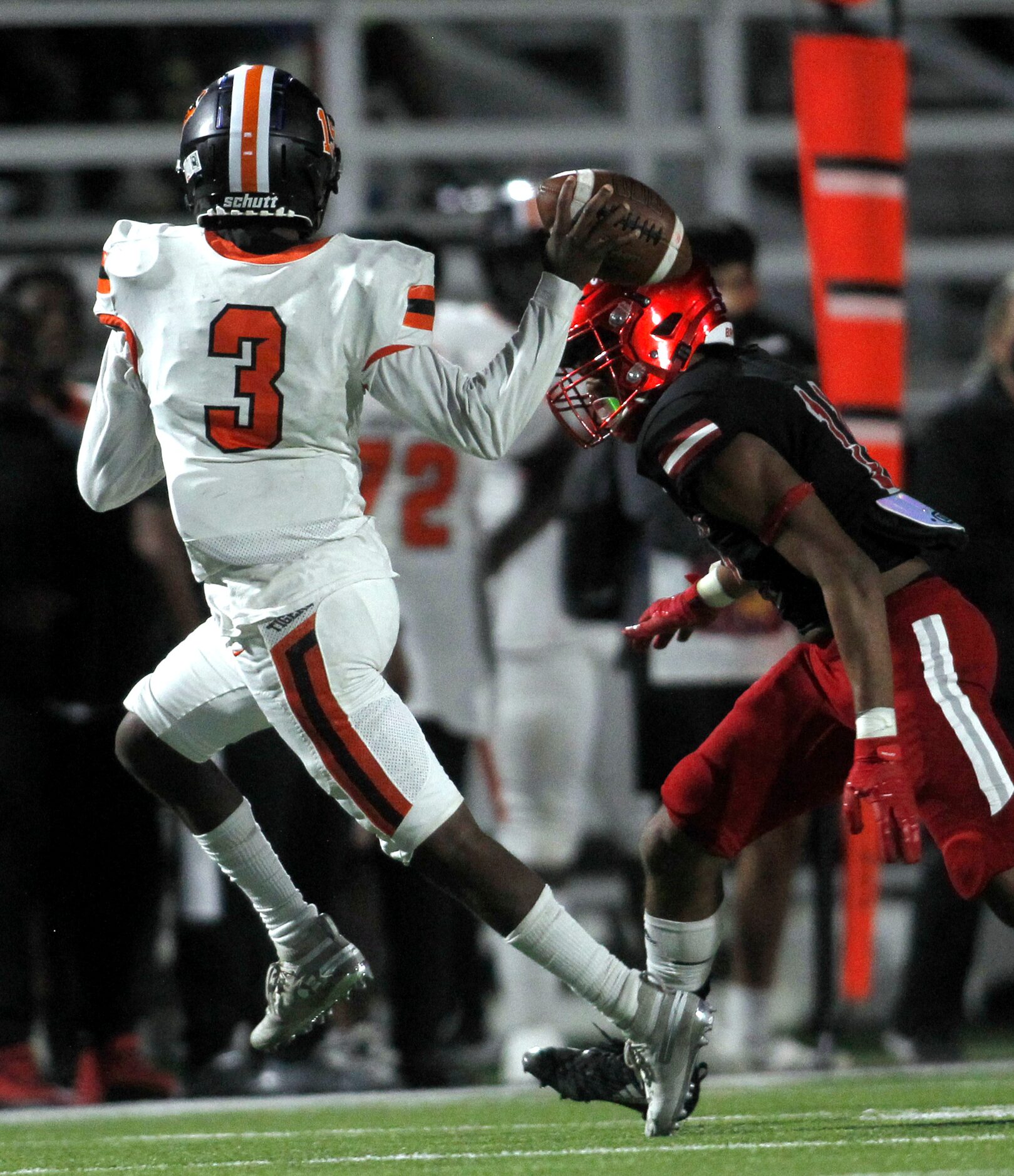 Lancaster quarterback Glenn Rice (3) gets off a pass while pressured by Dallas Woodrow...