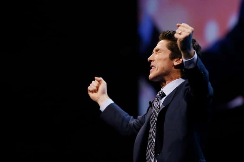 Joel Osteen, the pastor of Lakewood Church in Houston, prays during the "A Night of Hope" at...