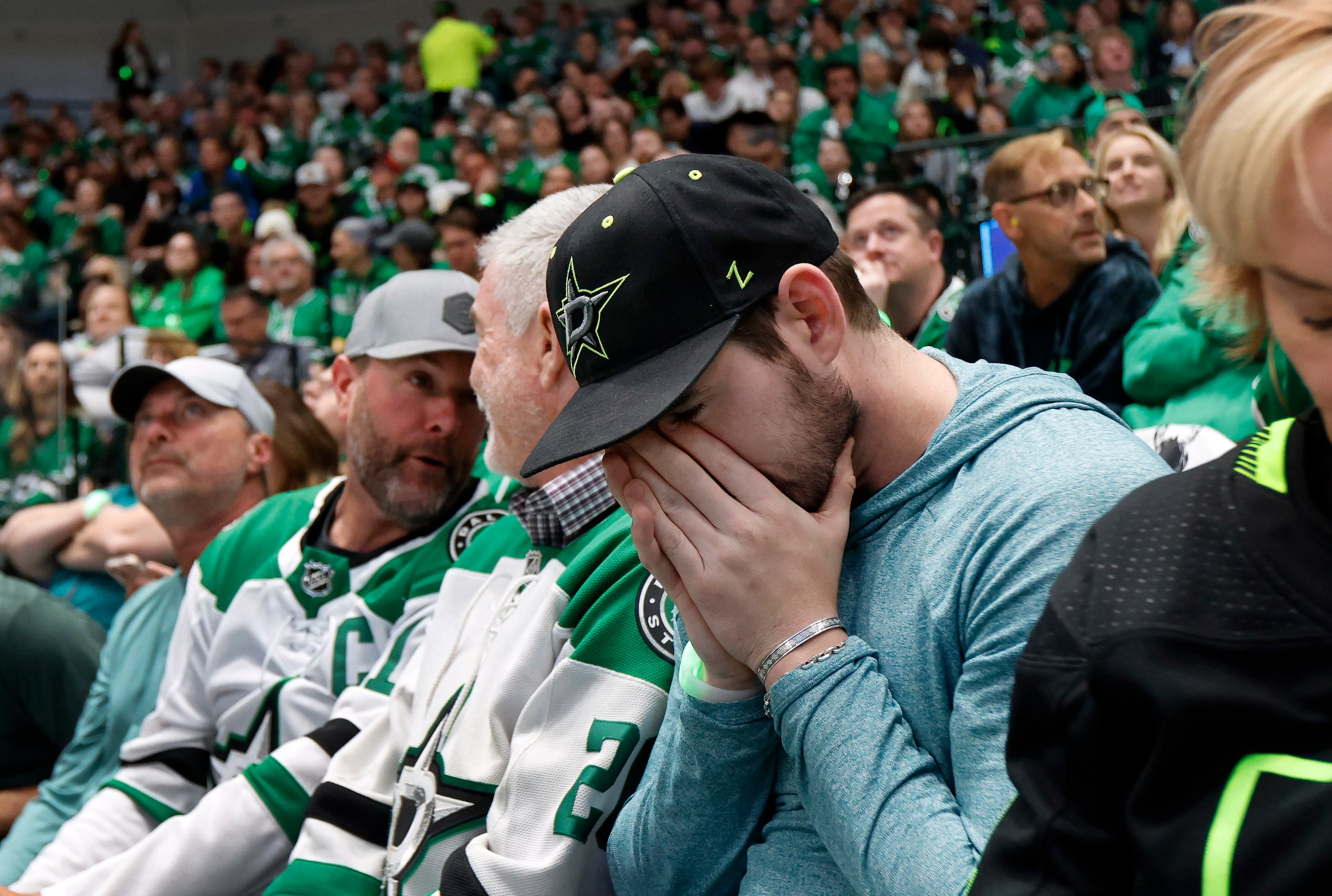 Dallas Stars fan Morgan Clark of Richardson reacts to the Vegas Golden Knights third goal...