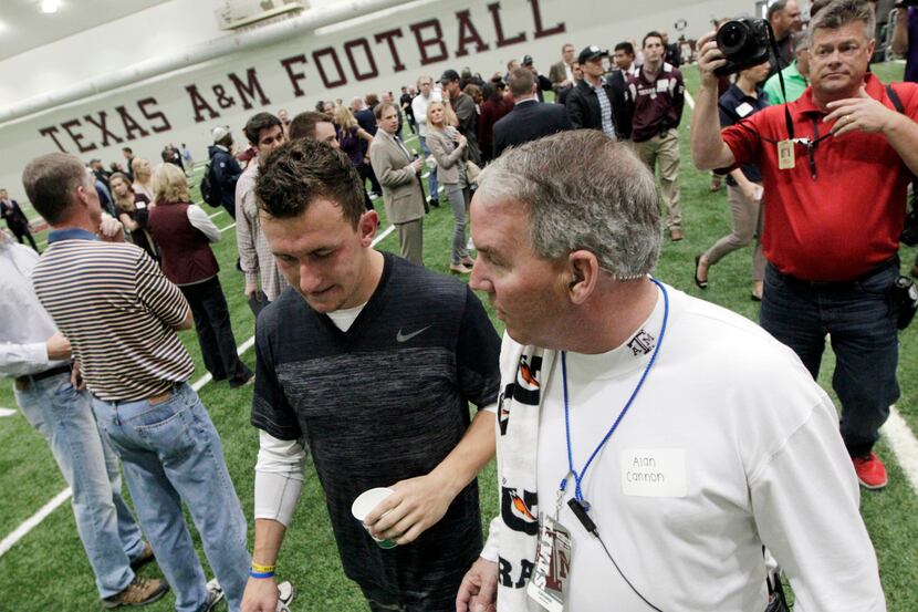 Texas A&M quarterback Johnny Manziel leaves the McFerrin Athletic Center after performing...