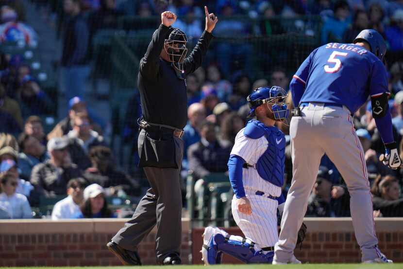Umpire Nestor Ceja calls a pitching clock violation on Chicago Cubs starting pitcher Marcus...