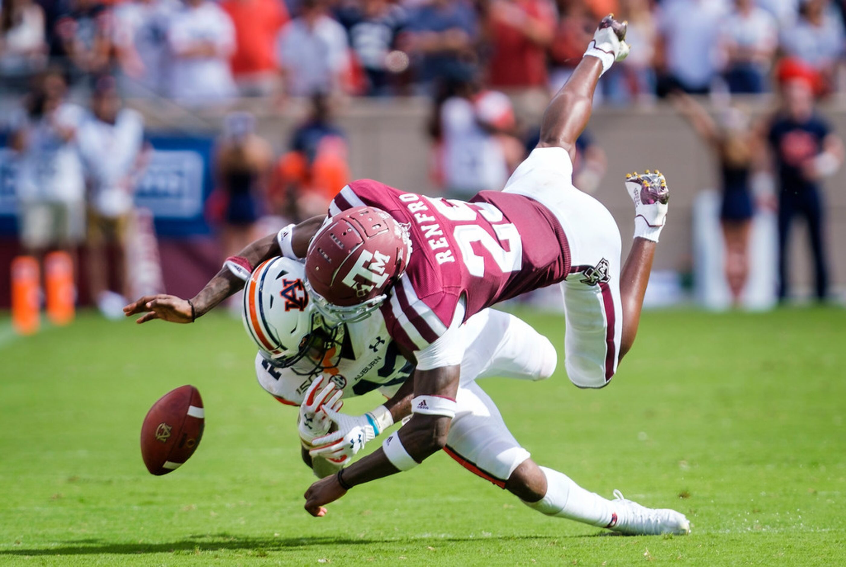 Texas A&M defensive back Debione Renfro (29) breaks up a pass intended for Auburn wide...