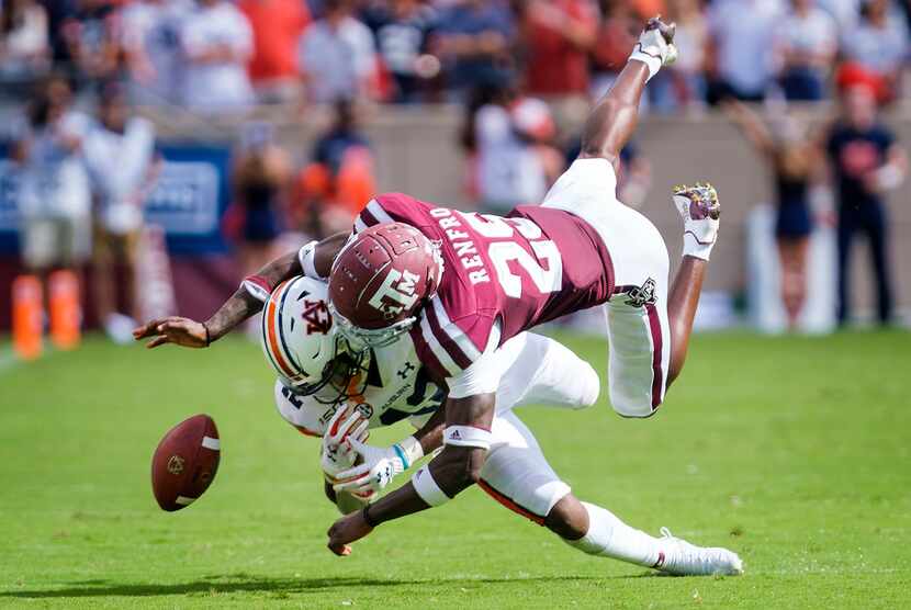 FILE - Texas A&M defensive back Debione Renfro (29) breaks up a pass intended for Auburn...