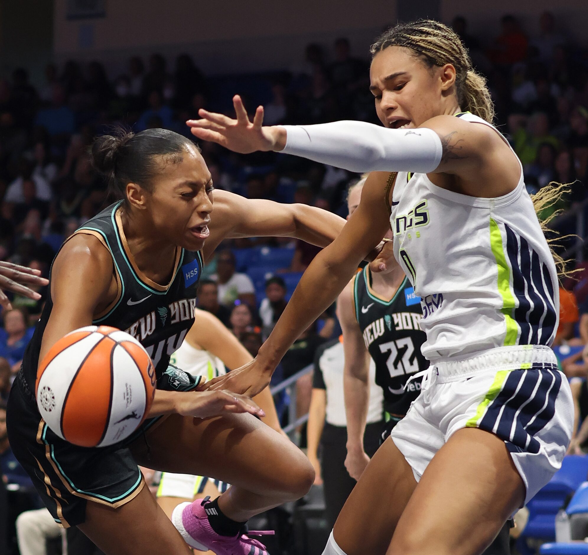 Dallas Wings forward Satou Sabally (0), right, battles New York Liberty forward Betnijah...