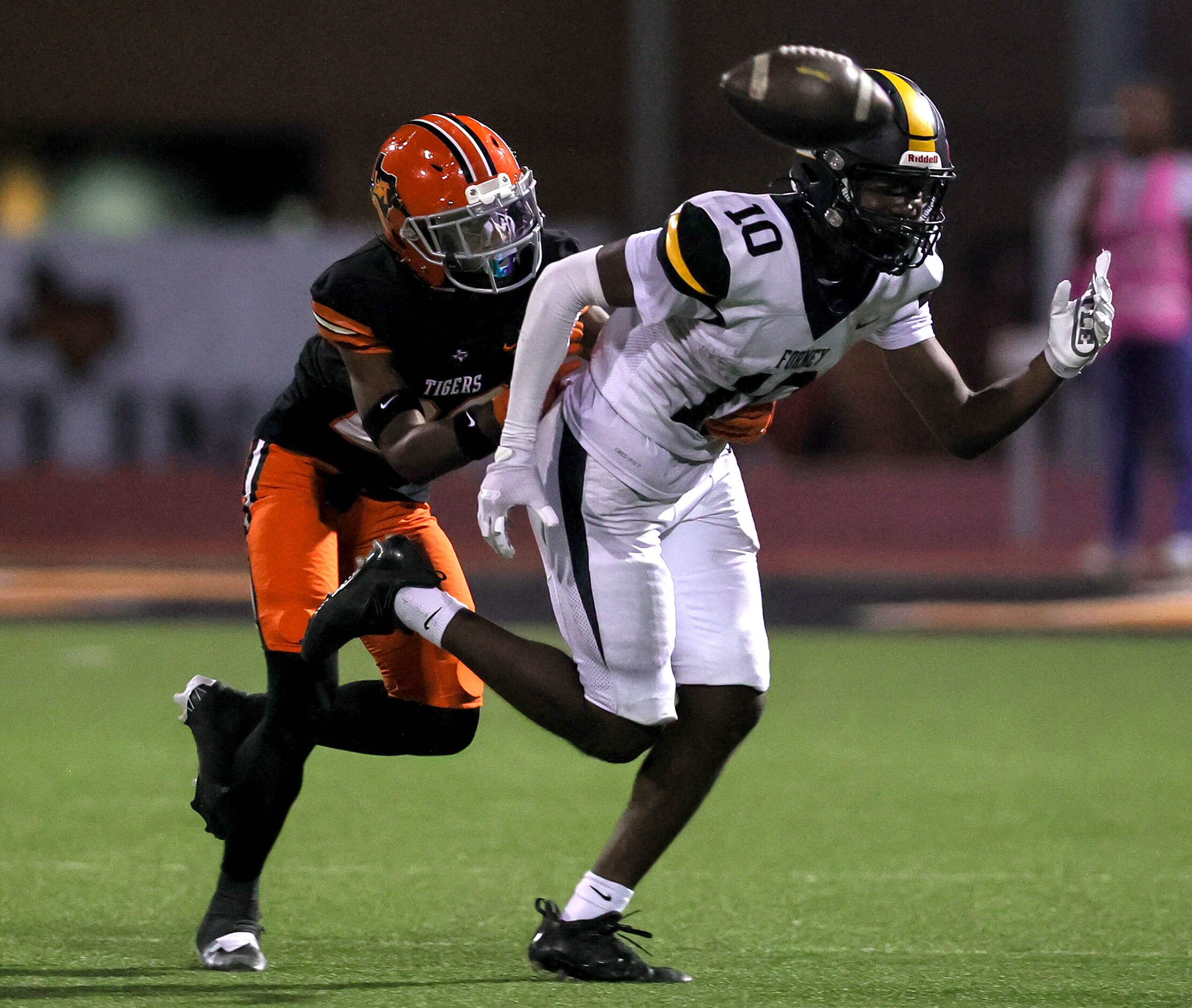 Forney wide receiver Kofi Eduful (10) tries to come up with a reception against Lancaster...