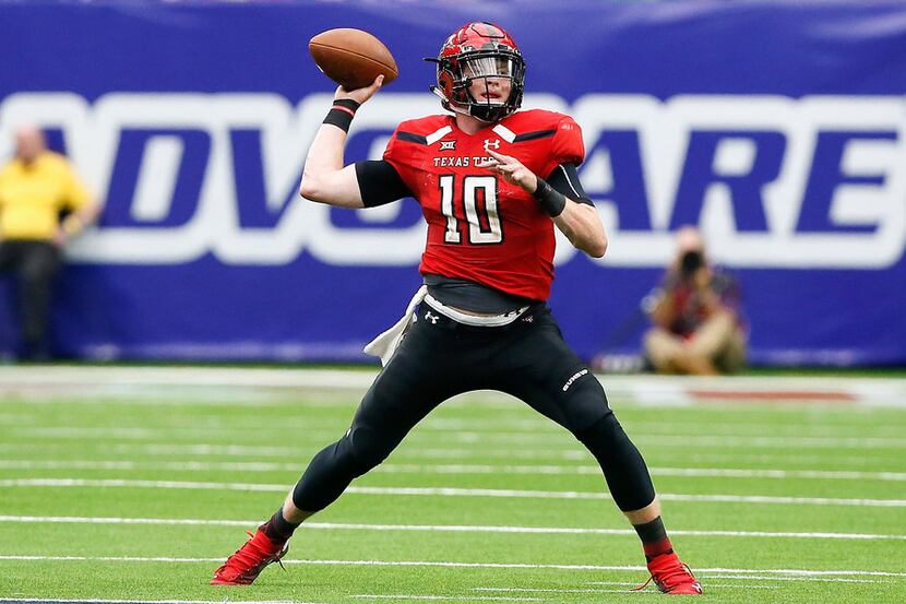 Alan Bowman #10 of the Texas Tech Red Raiders throws a pass in the third quarter against the...