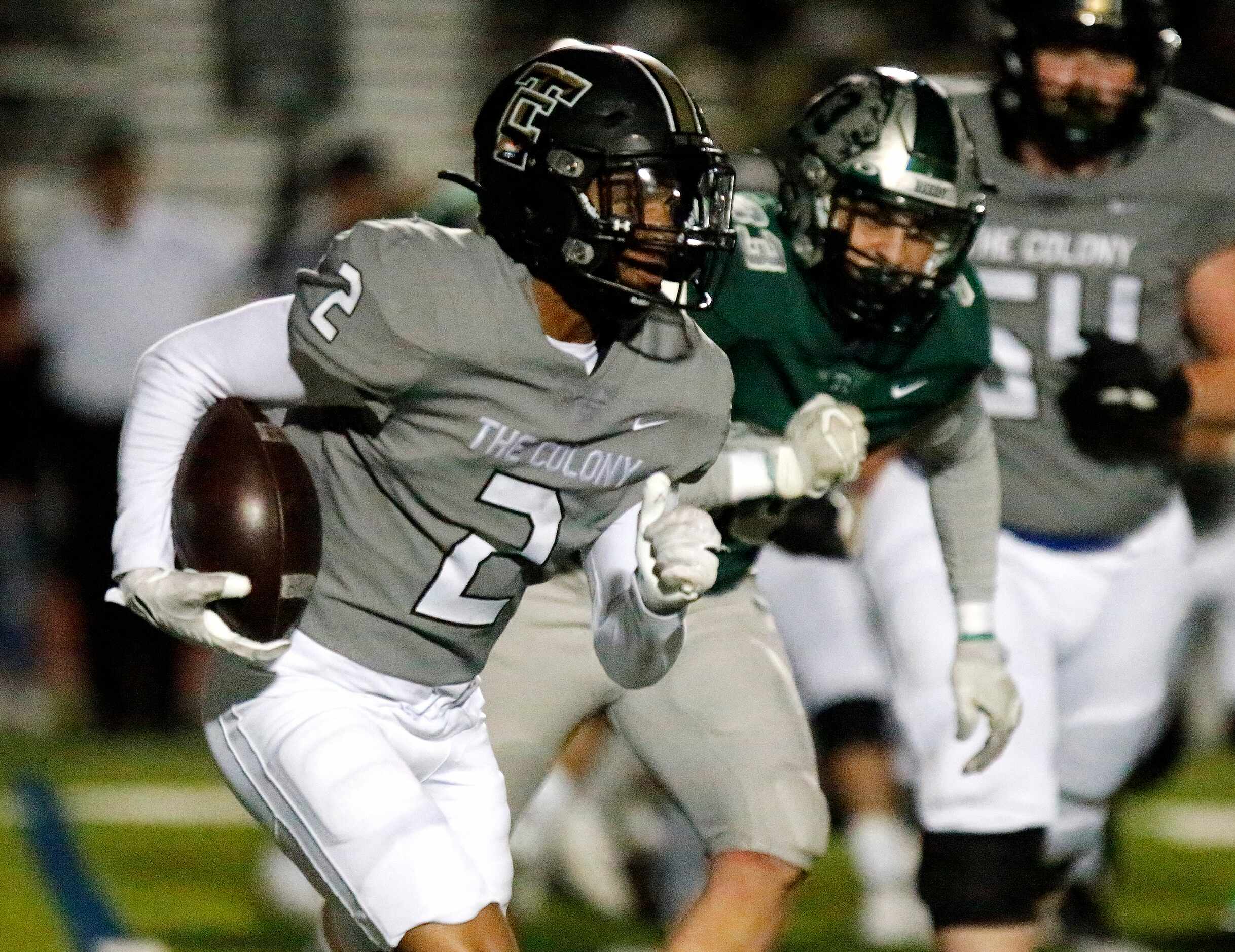 The Colony High School running back Shafiq Taylor (2) runs away from Frisco Reedy High...