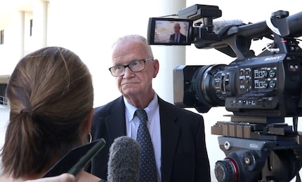 Michael Griffiths, interim director of Dallas County's Juvenile Department, listens to the...