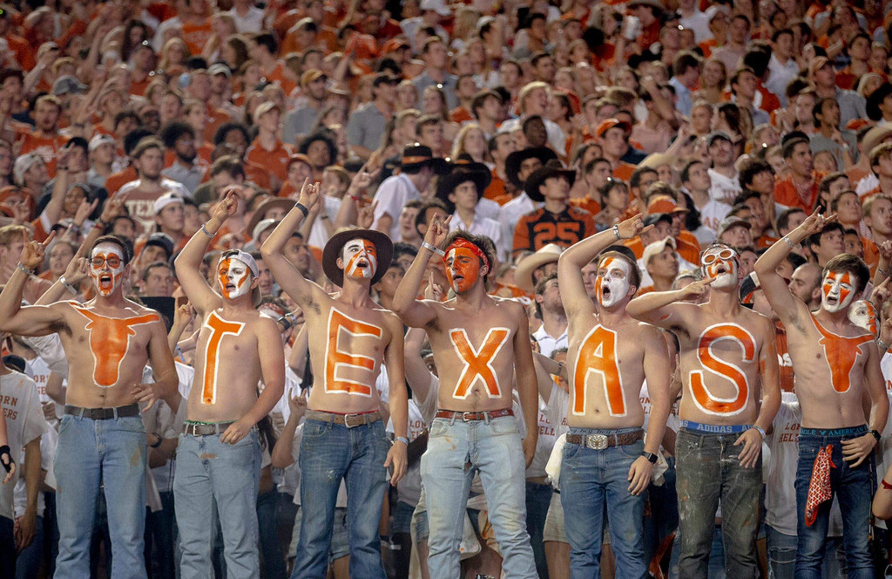 Texas fans celebrate a touchdown against Oklahoma State on Saturday, Sept. 21, 2019, at...