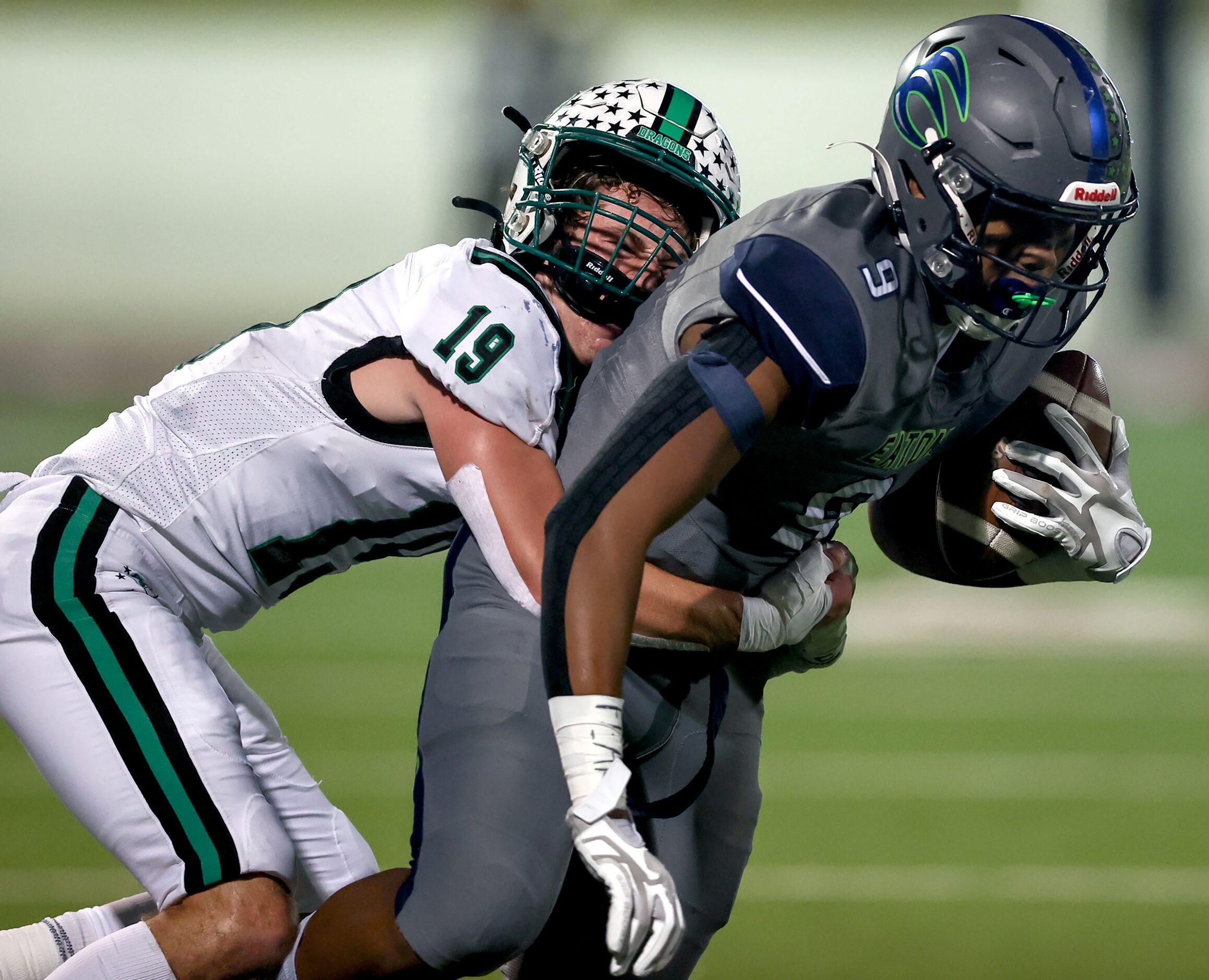 Eaton wide receiver Jaden Platt (9) draggs Southlake Carroll defensive back Logan Anderson...