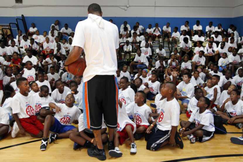 Dallas native and NBA power forward Kenyon Martin talked to kids at Tommie Allen Recreation...