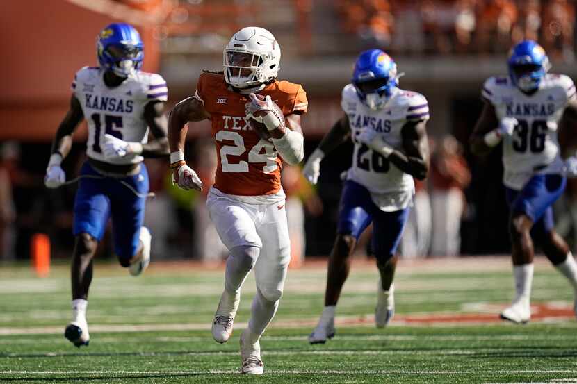 Texas running back Jonathon Brooks (24) breaks away for a touchdown run against Kansas...