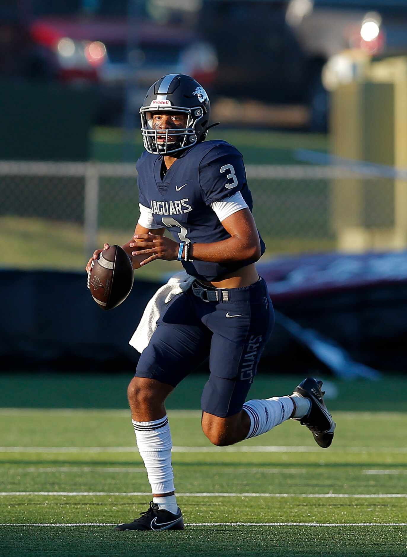 Flower Mound senior quarterback Nick Evers (3) looks for a receiver  during the first half...