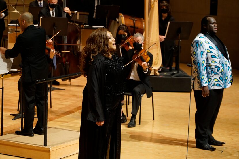 Michelle Bradley and Reginald Smith Jr. sing "Lift Every Voice and Sing" with the Dallas...