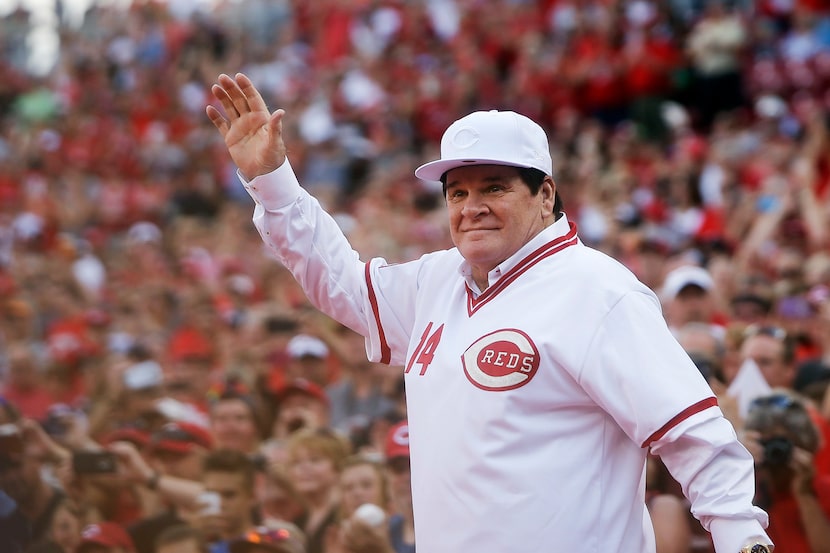 In this June 24, 2016, file photo, former Cincinnati Red Pete Rose waves to the crowd as he...