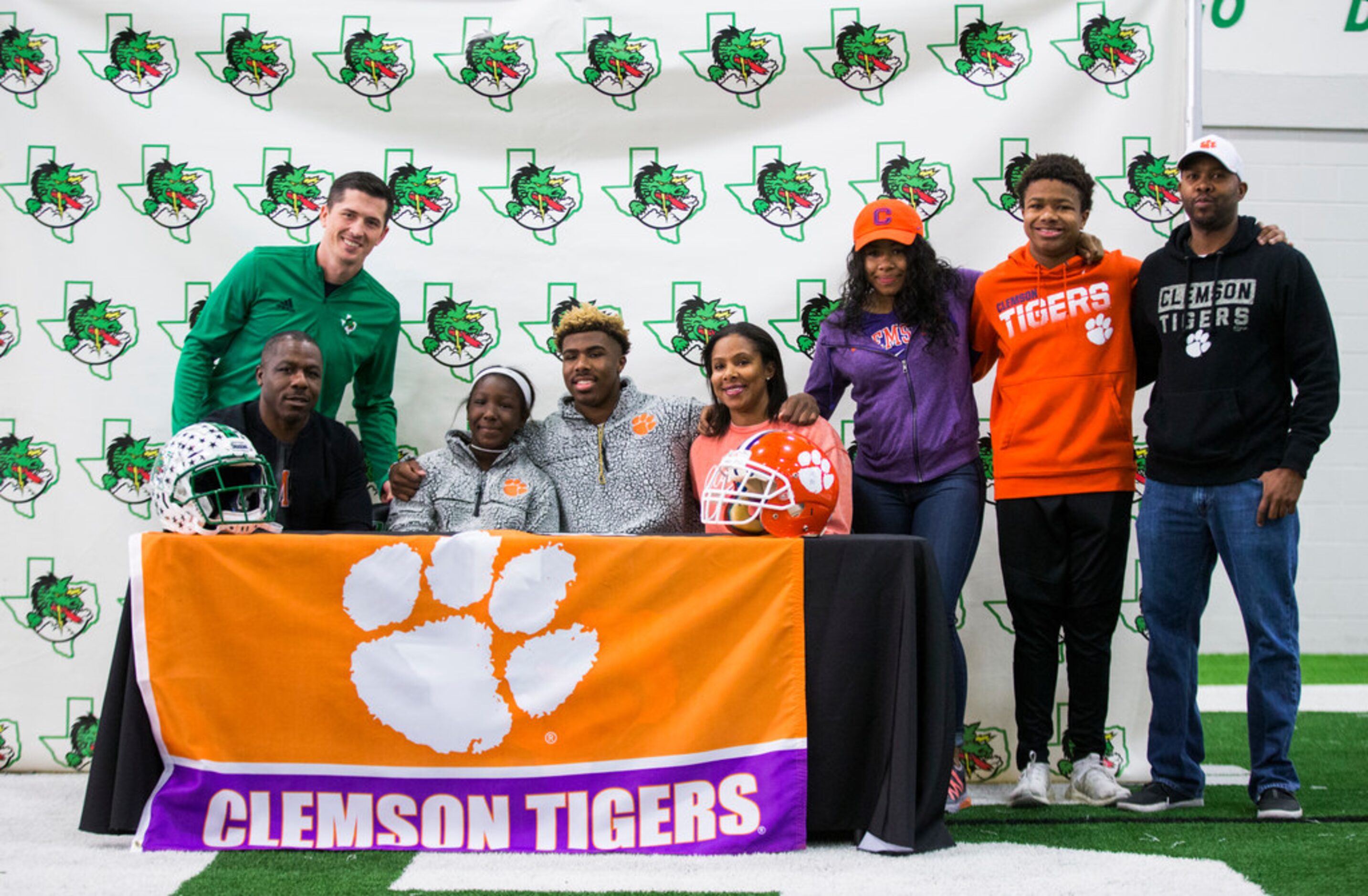 Southlake Carroll football player RJ Mickens (center) poses for a photo with his family and...