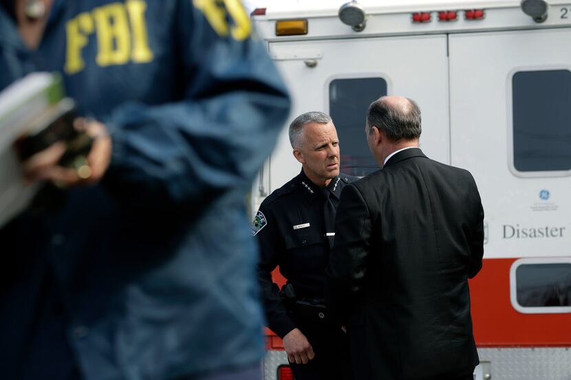 Interim Austin Police Chief Brian Manley talks with FBI Special Agent in Charge Christopher...