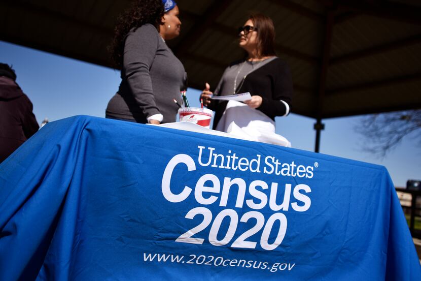 Rita Williams, left, a partnership specialist with the U.S. Census Bureau, speaks with...