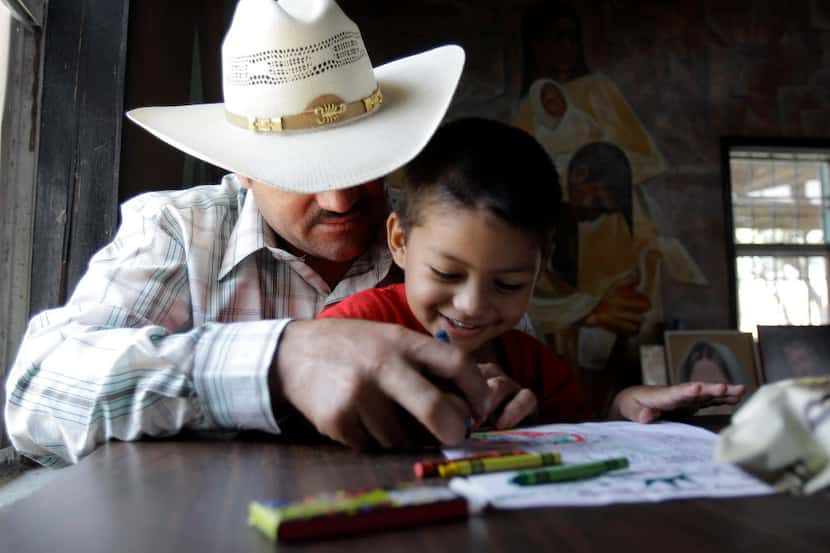  Miguel, 3, plays with his father, Miguel, an illegal immigrant, Friday, Aug. 27, 2010, in...