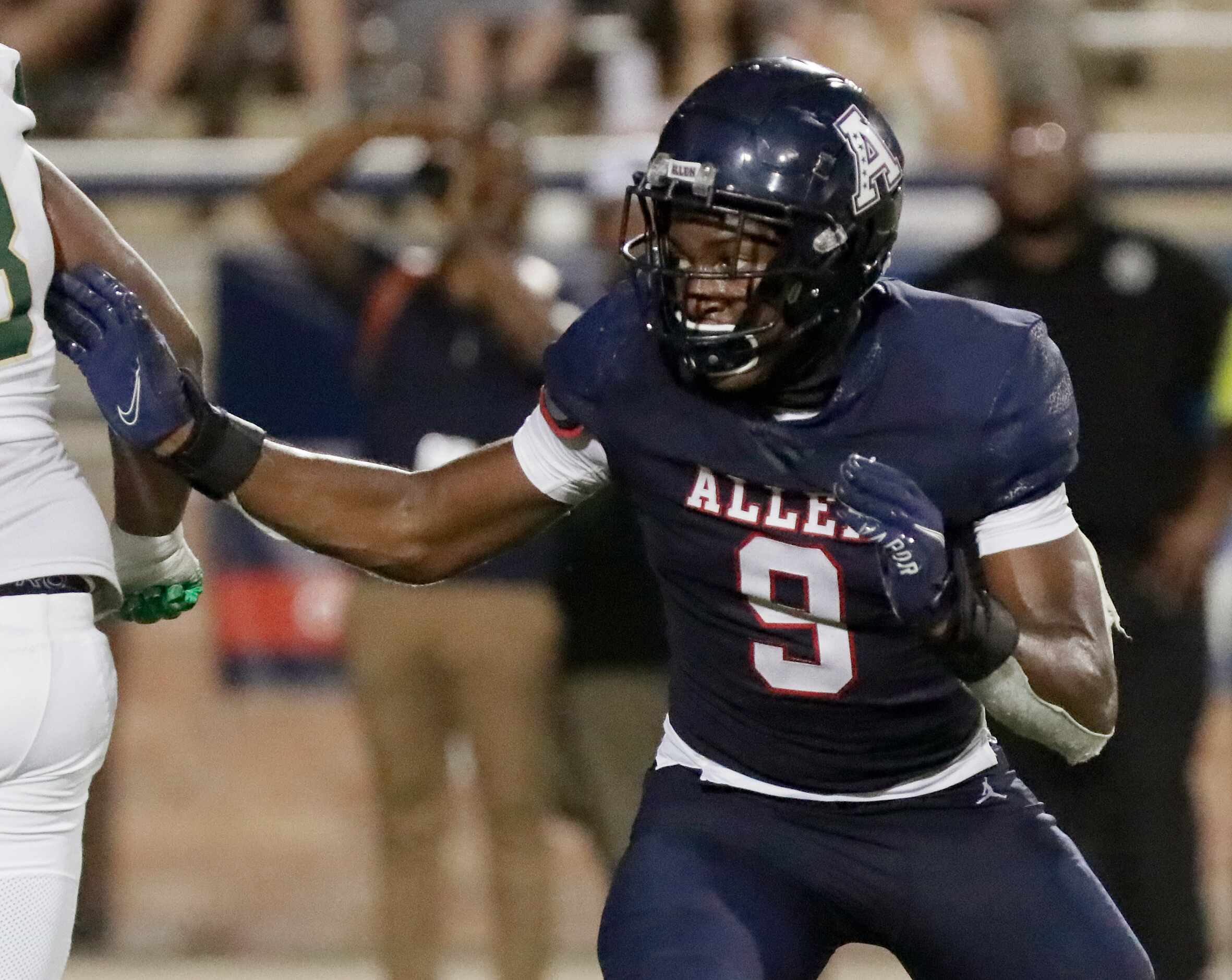 Allen High School defensive lineman Zina Umeozulu (9)  gives pursuit during the first half...