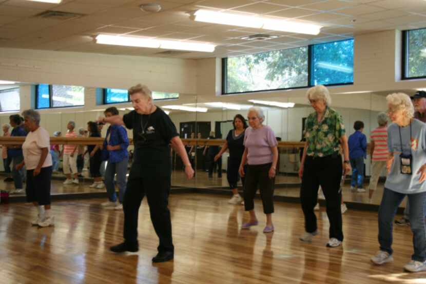 Marilyn Kramer (center left) leads the Young at Heart Line Dancers during a class at Harry...