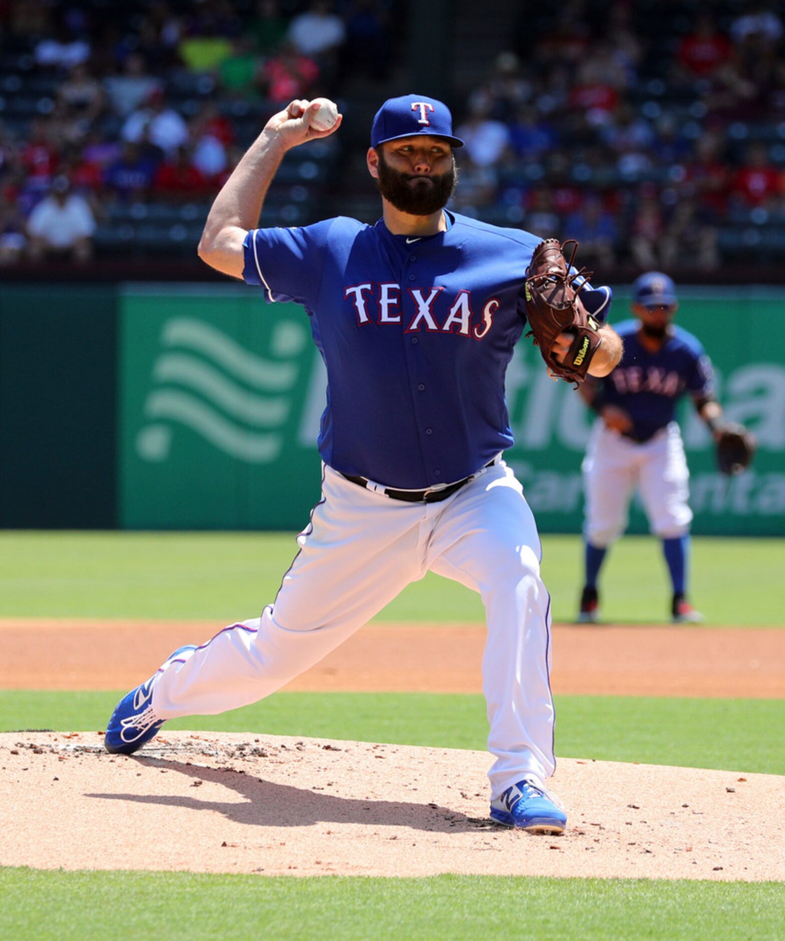 Texas Rangers starting pitcher Lance Lynn delivers against the Minnesota Twins in the first...