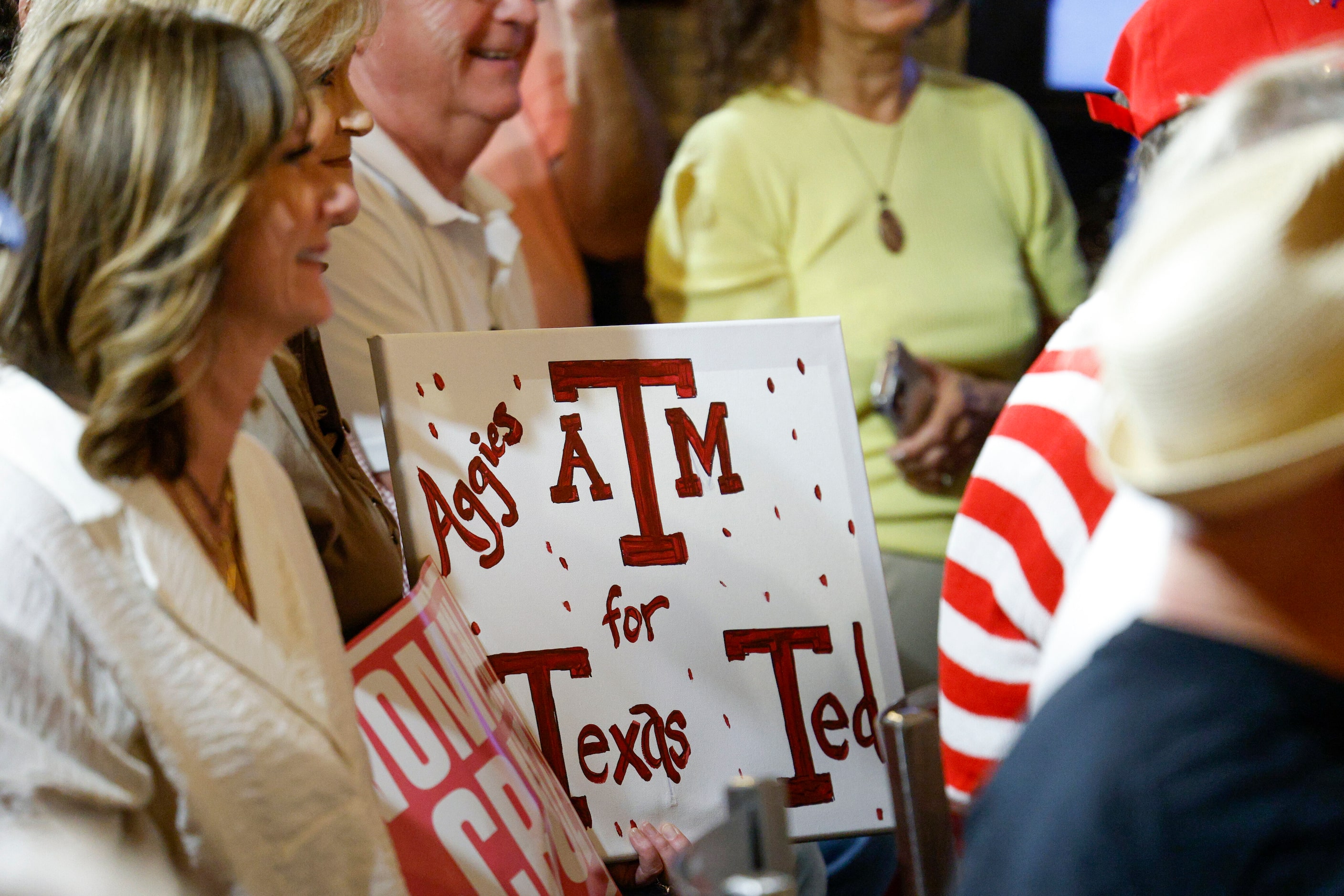 A woman holds a sign during a campaign rally for Senator Ted Cruz (R-Texas) at Outpost 36...