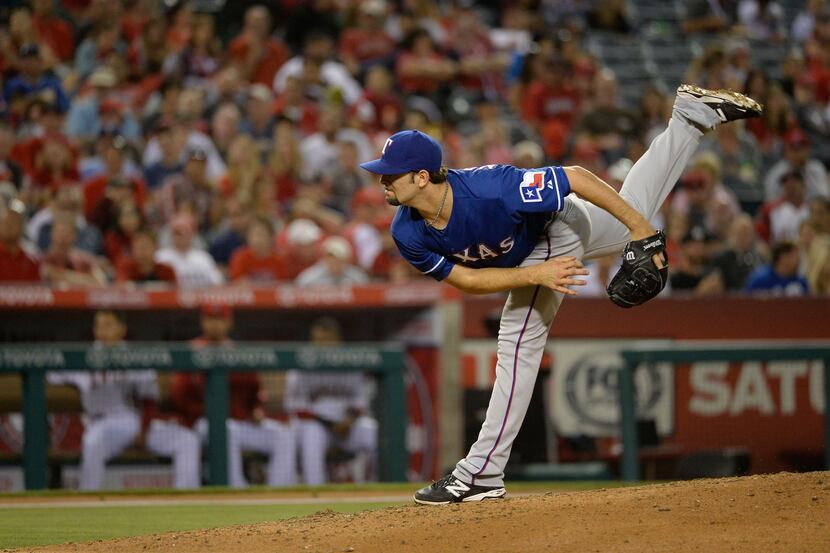 Jun 21, 2014; Anaheim, CA, USA; Texas Rangers starting pitcher Nick Martinez (22) delivers a...