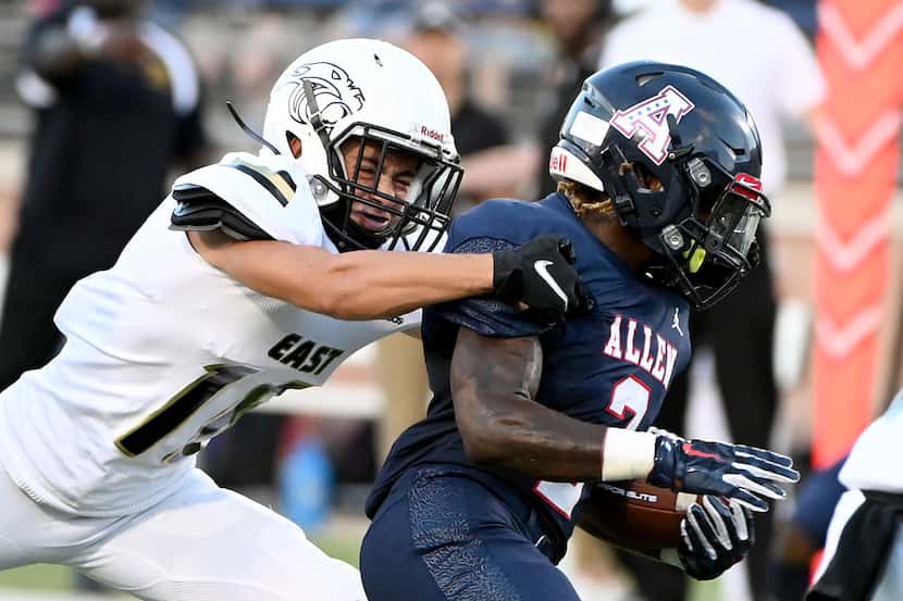 Plano East’s Holden Stokes tackles Allen’s Jaylen Jenkins (2) in the first half during a...