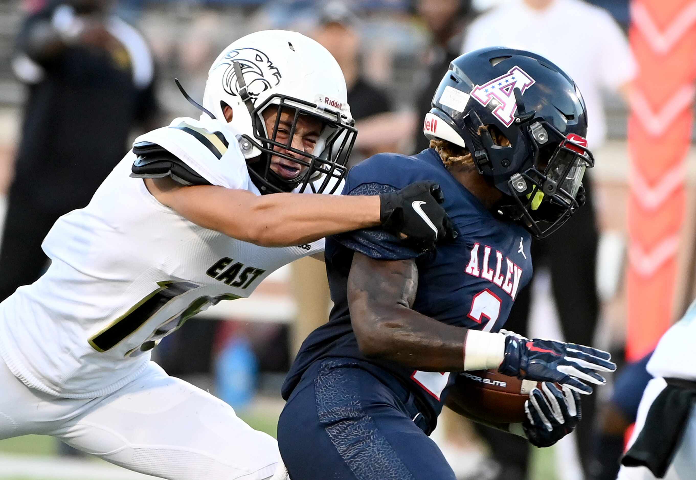 Plano East’s Holden Stokes tackles Allen’s Jaylen Jenkins (2) in the first half during a...