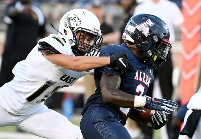 Plano East’s Holden Stokes tackles Allen’s Jaylen Jenkins (2) in the first half during a...