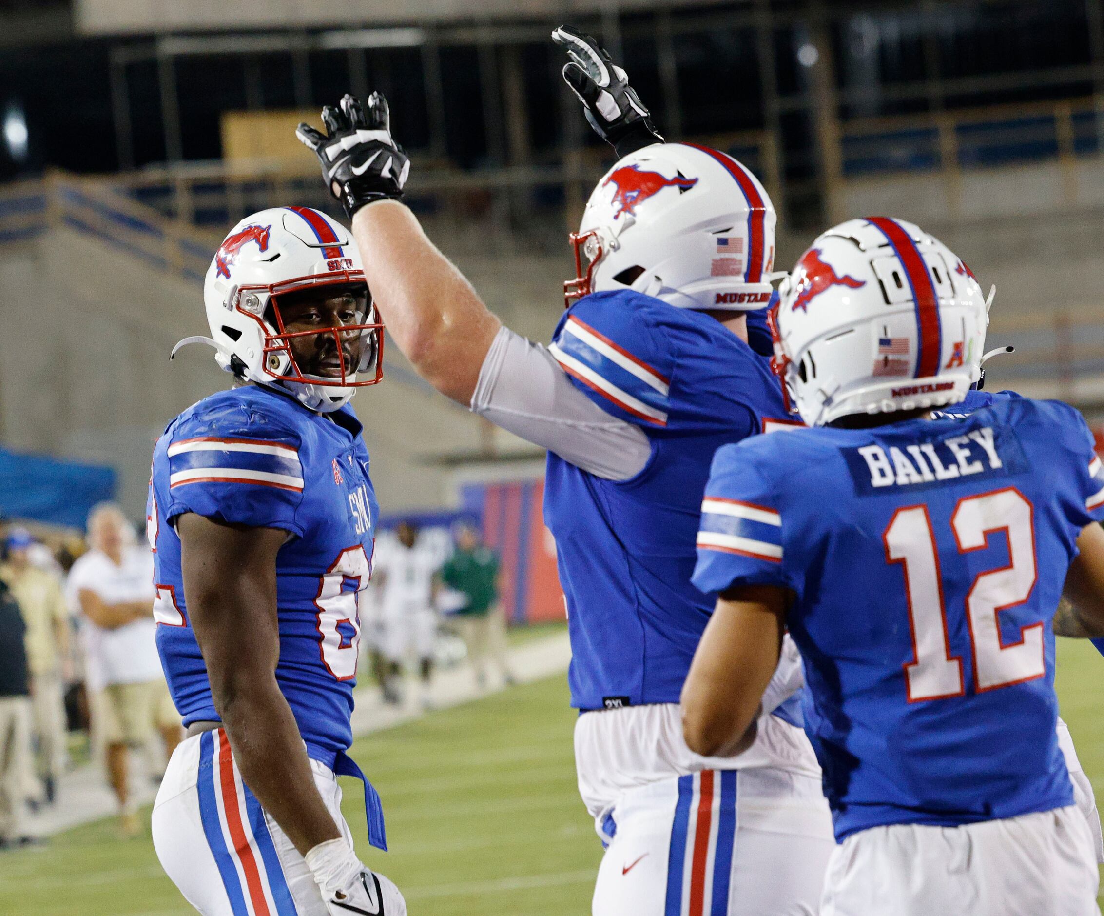 SMU tight end RJ Maryland (82), left, is congratulated by SMU offensive lineman Logan Parr...