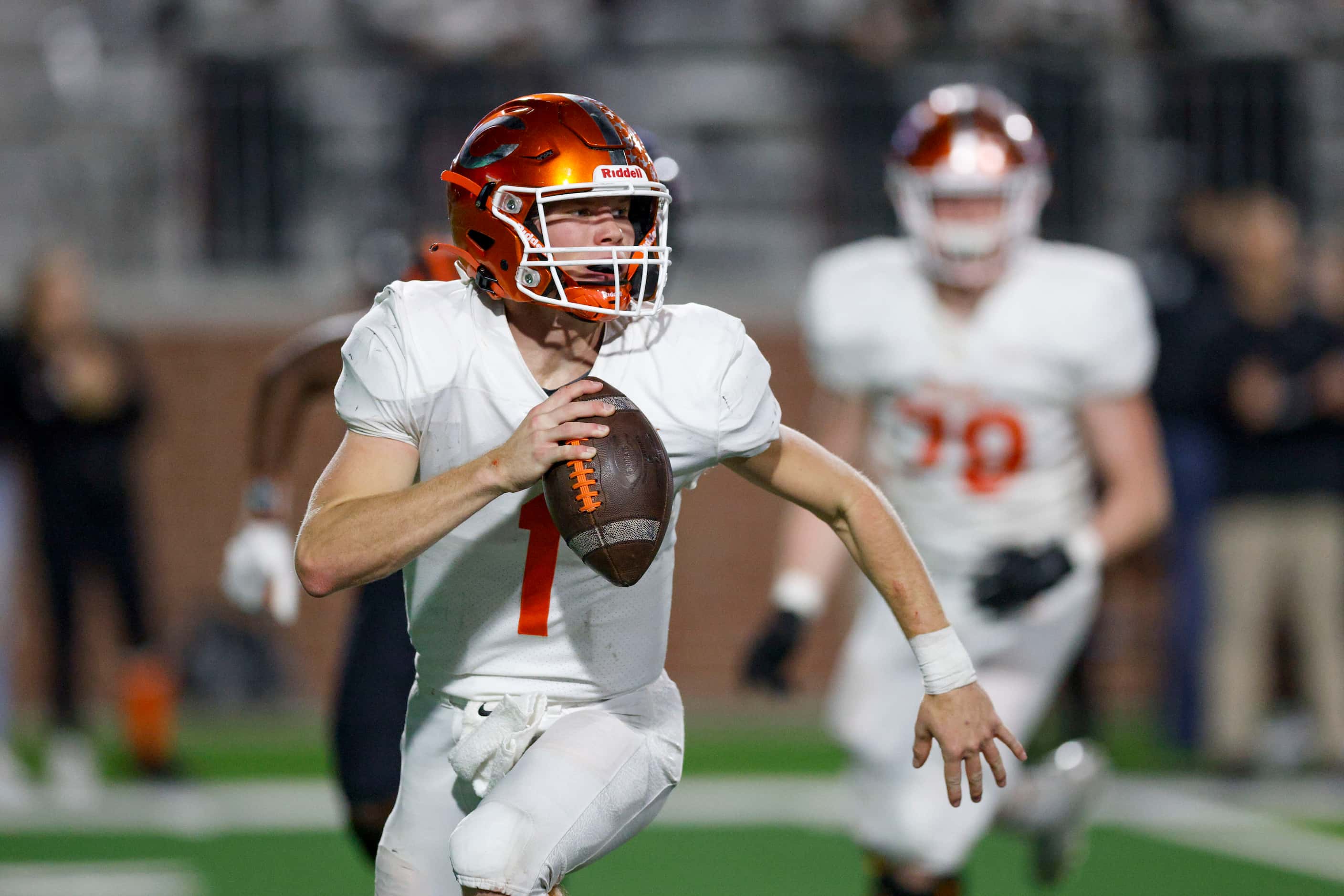 Celina quarterback Noah Bentley (1) looks to pass during the second half of their Class 4A...