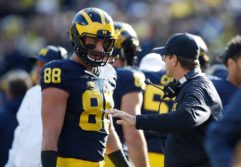 ANN ARBOR, MI - OCTOBER 22: Jake Butt #88 of the Michigan Wolverines talks with head coach...