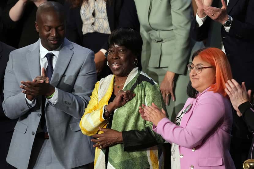 Bettie Mae Fikes of Selma, Ala., stands as President Joe Biden recognizes her during the...