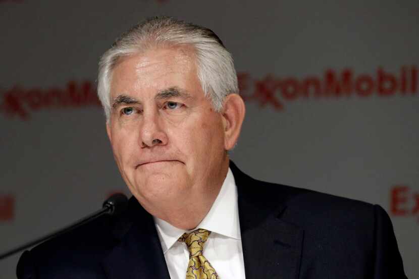 ExxonMobil CEO Rex Tillerson listens to a reporter's question after the annual meeting...