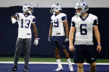 Dallas Cowboys receiver Amari Cooper (19) talks with Dallas Cowboys wide receiver Michael...