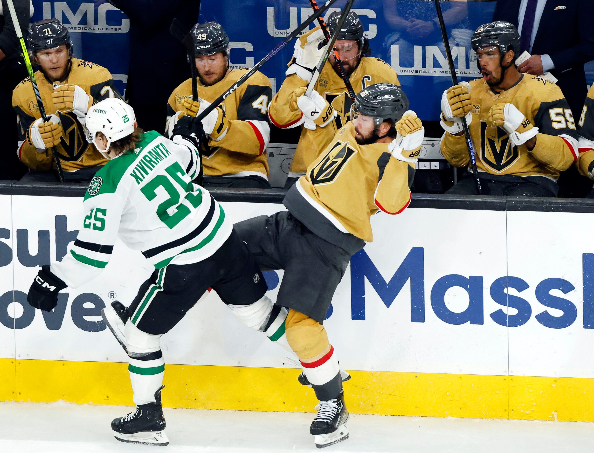 Dallas Stars left wing Joel Kiviranta (25) forces Vegas Golden Knights center Chandler...