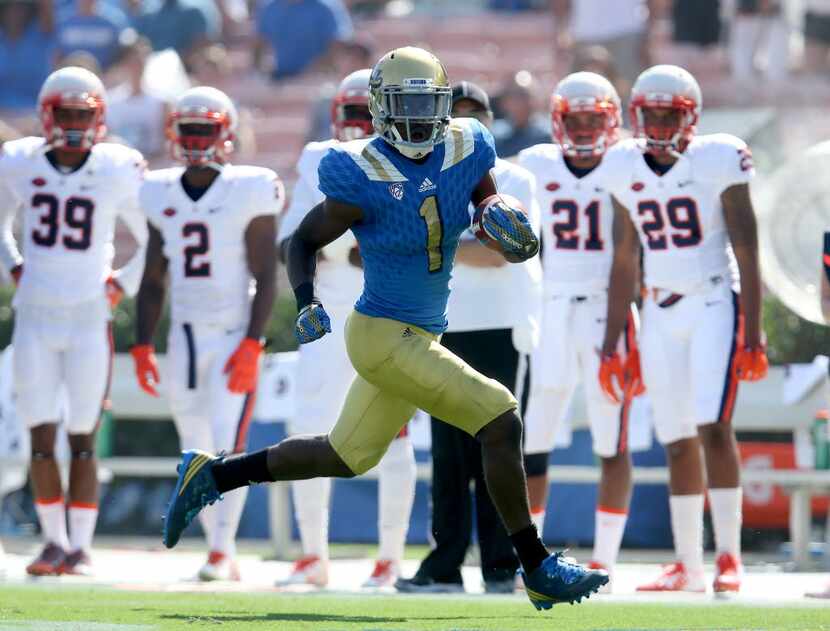 PASADENA, CA - SEPTEMBER 05:  Running back Soso Jamabo #1the UCLA Bruins carries the ball on...