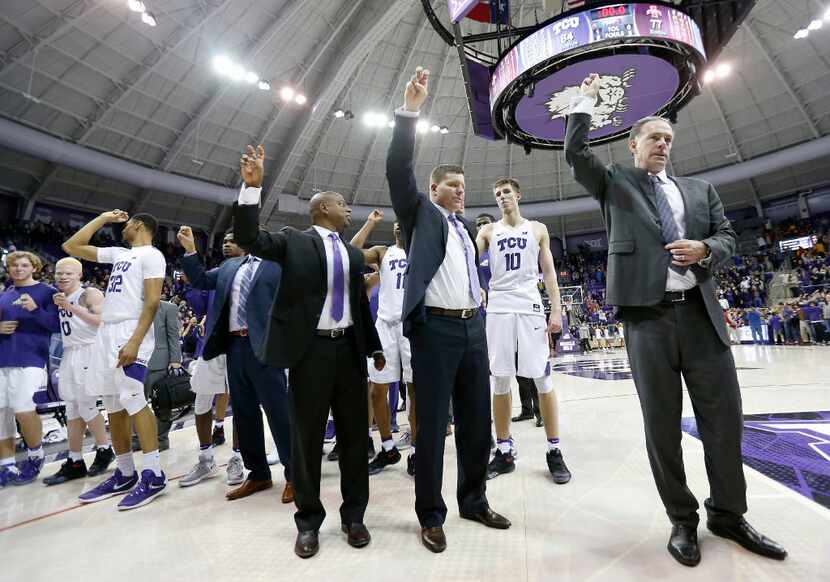 FILE - TCU Horned Frogs head coach Jamie Dixon (right) join the team celebrating a 84-77 win...