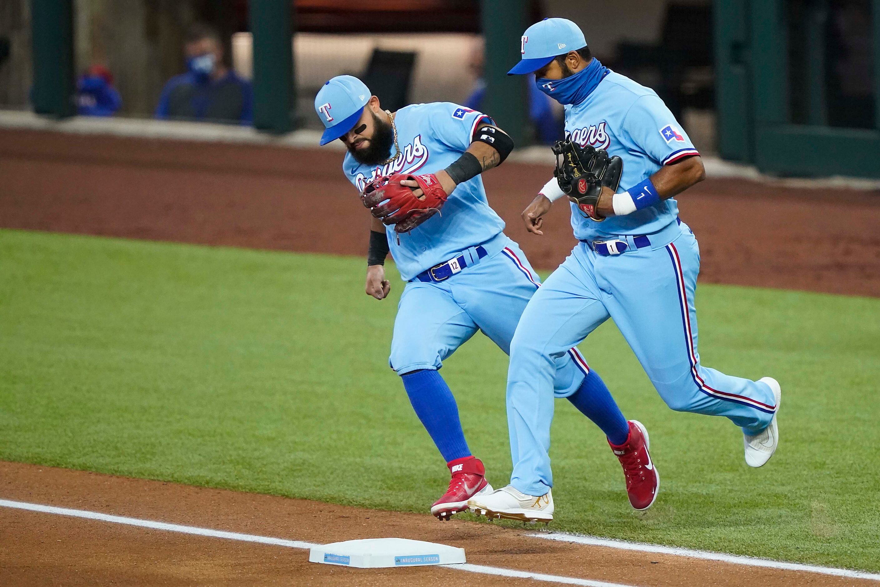 Texas Rangers second baseman Rougned Odor (left) and shortstop Elvis Andrus take the field...