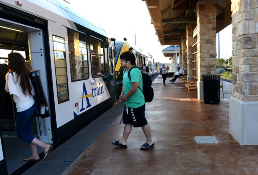 Riders board the A-Train at Hebron Station in Lewisville. In the first year of the DCTA's...
