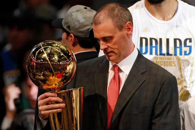 Dallas Mavericks head coach Rick Carlisle takes a good look at the Larry O'Brien NBA...