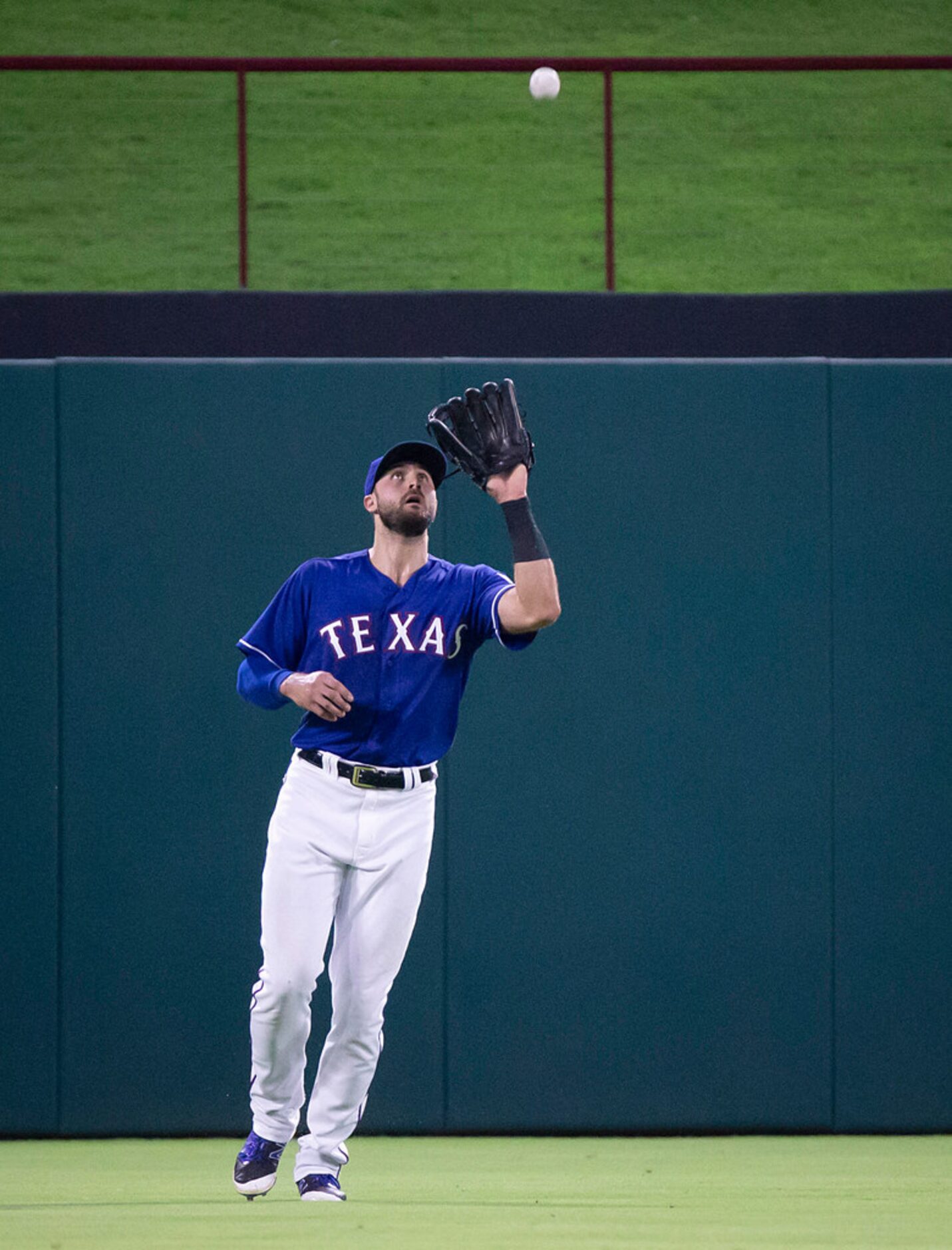 Texas Rangers center fielder Joey Gallo catches a fly ball off the bat of Houston Astros...